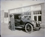 Box 40, Neg. No. 53447: Man Standing by a Model T Car Outside