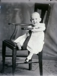 Box 40, Neg. No. 53446:  Baby Sitting on a Chair