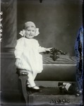 Box 41, Neg. No. 53250:  Baby Sitting on the Arm of a Chair