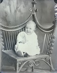Box 41, Neg. No. 52811: Baby Sitting on a Chair