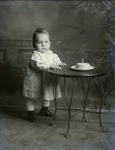 Box 42, Neg. No. 52903: Baby Standing Next to a Table
