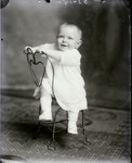 Box 42, Neg. No. 53415: Baby Sitting on a Chair