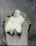 Box 42, Neg. No. 52567:  Baby Sitting on a Chair