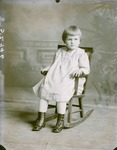 Box 42, Neg. No. 52946: Girl in a Rocking Chair