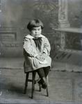 Box 42, Neg. No. 52969R: Girl Sitting on a Stool