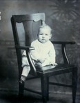 Box 42, Neg. No. 53004: Baby Sitting in a Chair