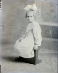 Box 43, Neg. No. 52945: Girl Sitting on a Bench