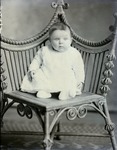Box 43, Neg. No. 52465: Baby Sitting on a Chair
