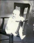 Box 43, Neg. No. 52441: Baby Sitting on a Chair