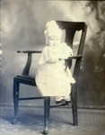 Box 43, Neg. No. 52439: Baby Sitting on a Chair
