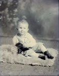Box 43, Neg. No. 52431: Boy Sitting on a Rug
