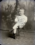 Box 43, Neg. No. 52431: Boy Sitting on a Chair