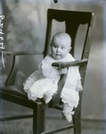 Box 43, Neg. No. 52464:  Baby Sitting on a Chair
