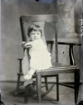 Box 43, Neg. No. 52711:  Baby Sitting on a Chair