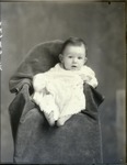 Box 43, Neg. No. 52725-R:  Baby Sitting on a Chair