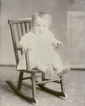 Box 44, Neg. No. 52600R: Baby Sitting on a Rocking Chair