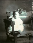 Box 44, Neg. No. 52394: Baby Sitting on a Chair