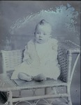 Box 45, Neg. No. 39061: Baby Sitting on a Chair