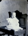 Box 45, Neg. No. 54525-R: Baby Sitting on a Bench