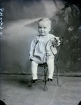 Box 46, Neg. No. 52487: Baby Sitting on a Chair