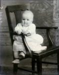 Box 46, Neg. No. 53108: Baby Sitting on a Chair