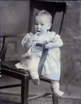Box 46, Neg. No. 52585: Baby Sitting on a Chair