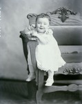 Box 46, Neg. No. 52570R: Baby Sitting on a Chair