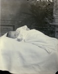 Box 46, Neg. No. Unknown: Baby Lying on a Blanket