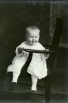 Box 48, Neg. No. 53288: Baby Sitting Sideways on a Chair