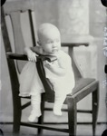 Box 49, Neg. No. 54546: Baby Sitting Sideways