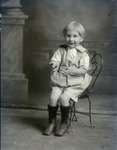 Box 50, Neg. No. 54130: Boy Sitting on a Chair