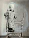 Box 51, Neg. No. 40505-R: Boy Standing on a Chair
