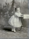 Box 54, Neg. No. 40745: Baby Standing Next to a Table
