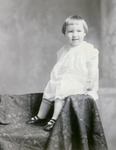 Box 55, Neg. No. 40973: Girl Sitting on the Arm of a Chair