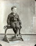 Box 56, Neg. No. 51661: Boy Sitting on a Bench