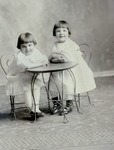 Box 56, Neg. No. 51586: Two Girls Sitting at a Table
