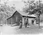 Box 12, Neg. No. Unknown: Man and Woman Outside by William R. Gray