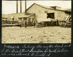 062-01: Four Men Collecting Motorboat from the Great West Lumber Mill
