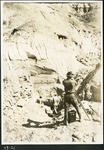 042-02: 43-21 George Sternberg Taking a Photo During Excavation by George Fryer Sternberg 1883-1969
