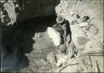 043-04: Two Men Examining a Fossil in a Pit by George Fryer Sternberg 1883-1969