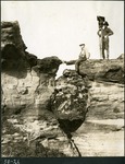 048-02: 50-21 Paleontologists Atop Two Divided Rock Formations by George Fryer Sternberg 1883-1969