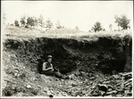 121-01: Charles W. Sternberg Holding Tertiary Shales in an Excavation Pit by George Fryer Sternberg 1883-1969