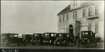008_03: No. 48-25 Automobiles in Front of the Sternberg Workshop by George Fryer Sternberg 1883-1969