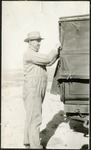 063_01: Man Standing by a Truck by George Fryer Sternberg 1883-1969