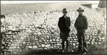 091_02: Two Men Stand at a Stone Wall by George Fryer Sternberg 1883-1969