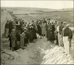 047_05: A Large Group of People Standing on Rocky Ground by George Fryer Sternberg 1883-1969