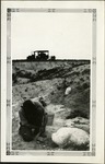 049_05: A Man Working on a Fossil in the Field by George Fryer Sternberg 1883-1969