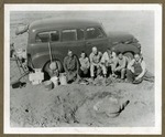 Group of Six by an Automobile