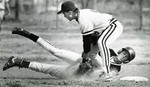 Baseball Player Tagging Out Opponent by Fort Hays State University Athletics