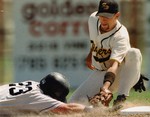 1998 Fort Hays State University Baseball Team Member Nate Field Tagging Out Opponent by Fort Hays State University Athletics